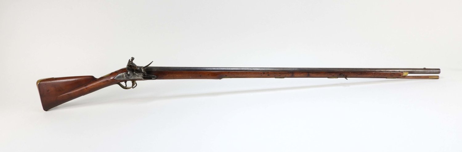 Circa 1760 British pattern light infantry carbine with a .69 bore, with a walnut stock with a storekeeper's stamp, 57 ½ inches long (the barrel 42 inches) ($19,680).